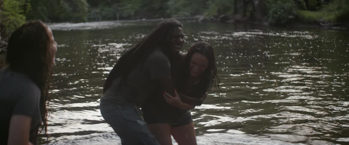 Two people are playing in the water