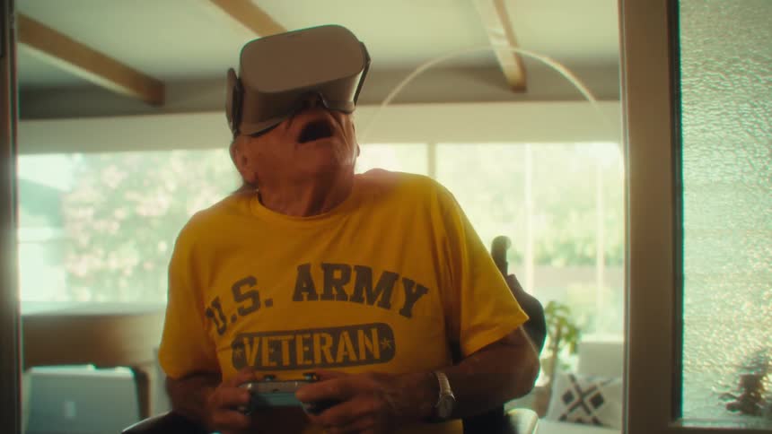 Elderly man in wheelchair experiences vr game