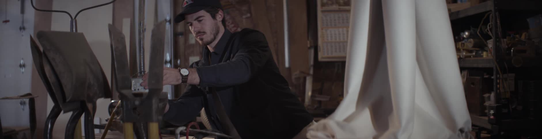 A man is working in a shed