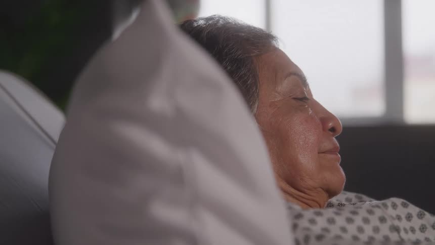 Woman lying in a hospital bed