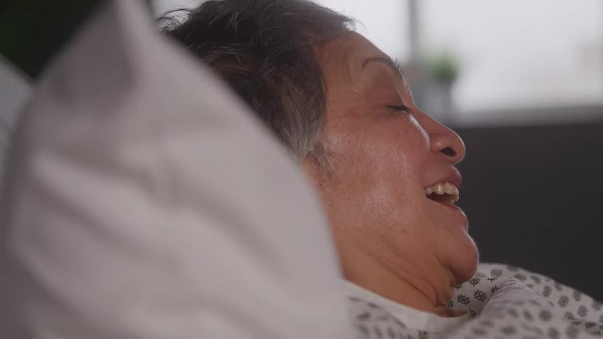 The patient is talking and smiling