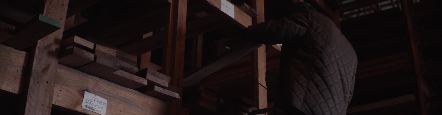 A man measures lumber