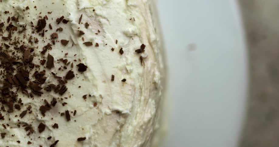 Chocolate is sprinkled over cake