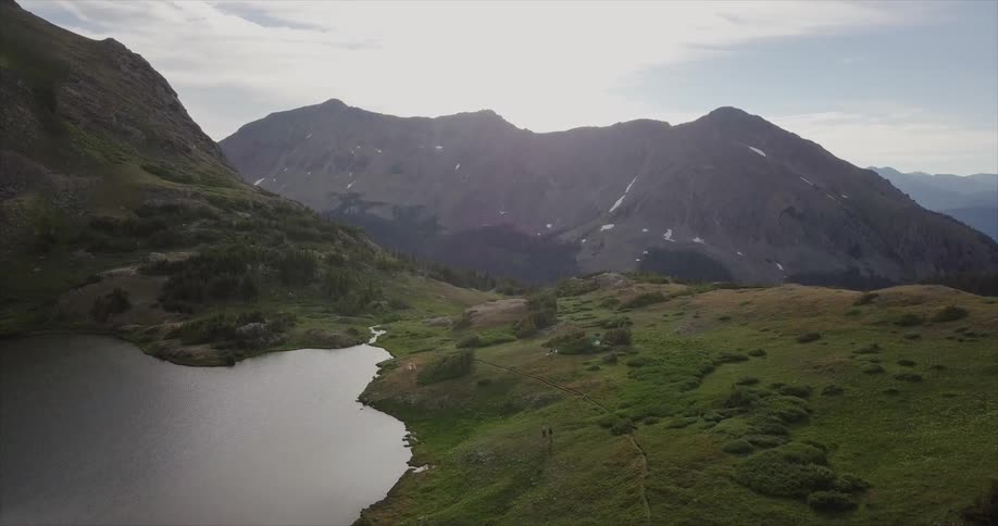 A lake is surrounded by mountains
