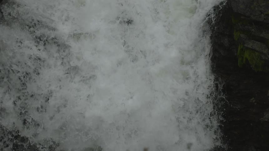 White rapids flow over rocks