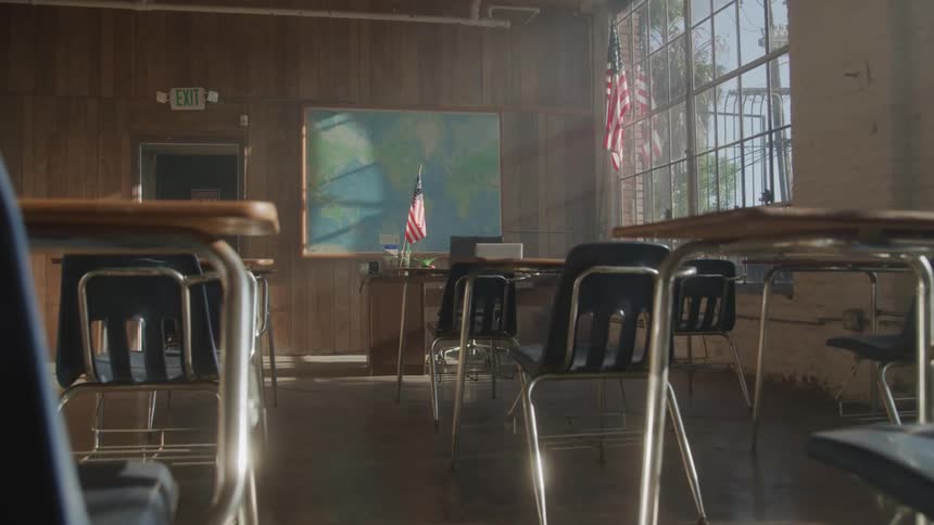Empty classroom with sunlight streaming through the windows