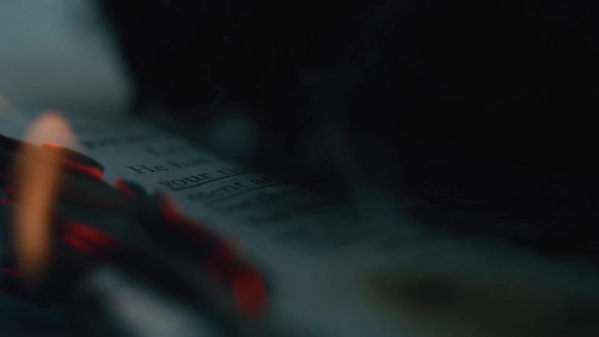A close up of the lit pages from a burning book