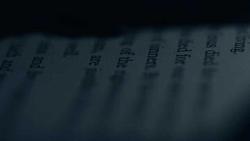 Book page appears in closeup with partially focused words