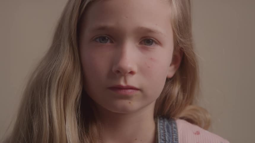 Portrait of a small blonde girl