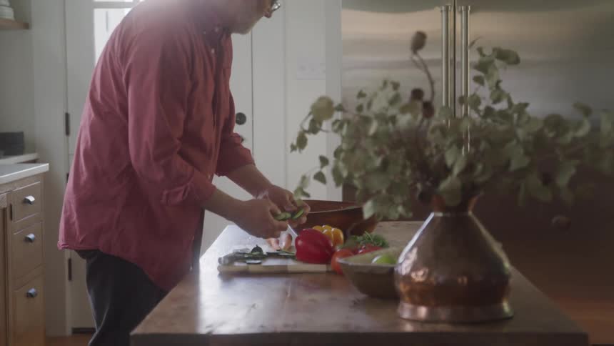 Man preparing a healthy dish in kitchen