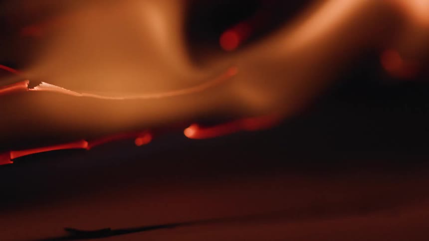 A flame burns brightly