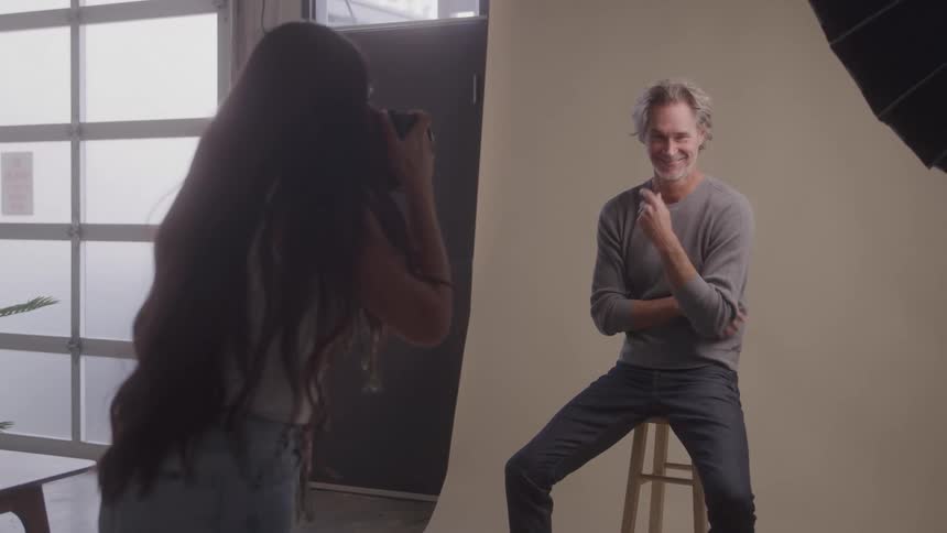 A photographer conducts a modeling photo shoot