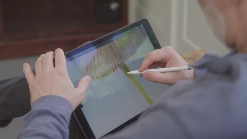 Person drawing on tablet