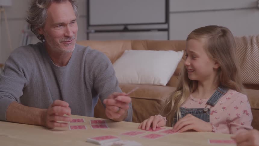 Father and daughter playing cards