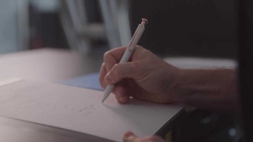 A person taking notes