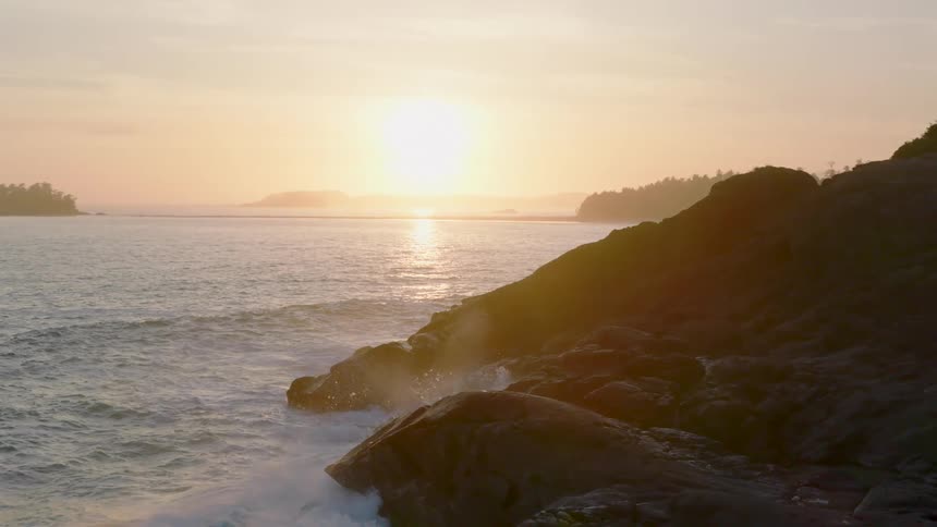 The sun rises over an island