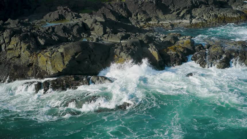 Waves crash against the rocks