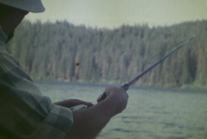 A man is fishing in a lake