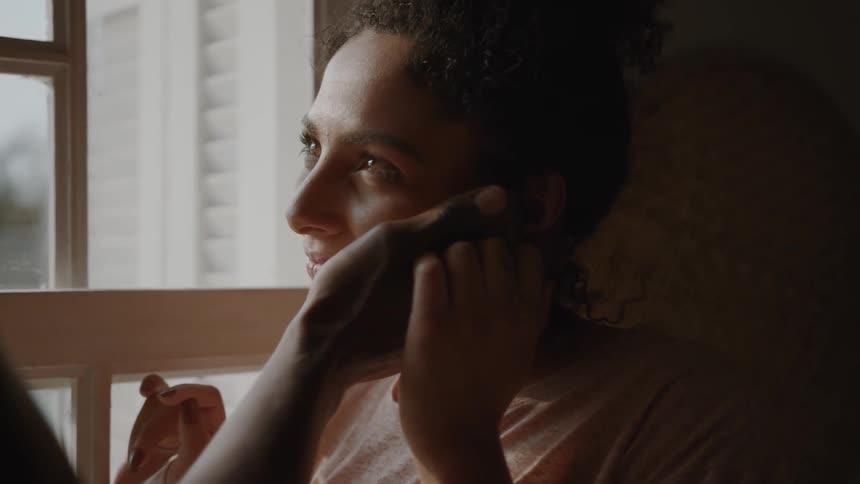 A man caressing a persons face