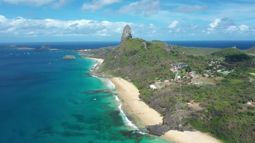 Aerial landscape of an island surrounded by a turquoise blue sea