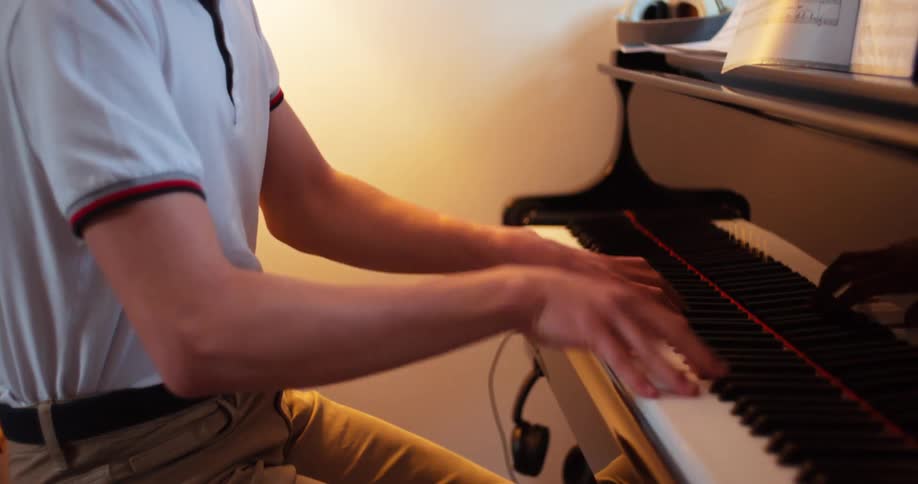 Person sitting playing piano
