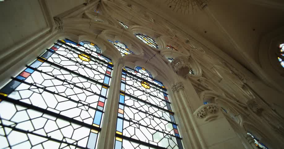 Artistic windows seen inside a cathedral