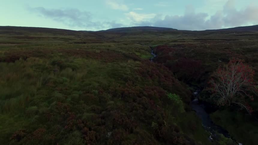 A river cuts through green terrain