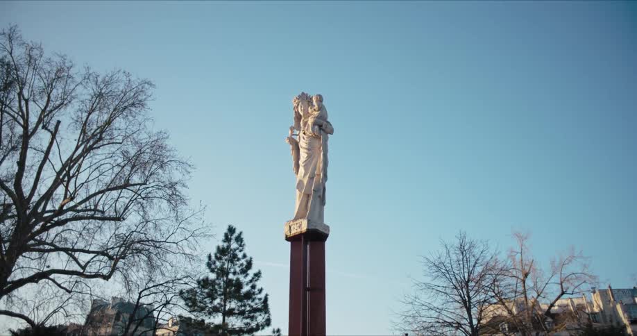 A marble statue atop a pillar