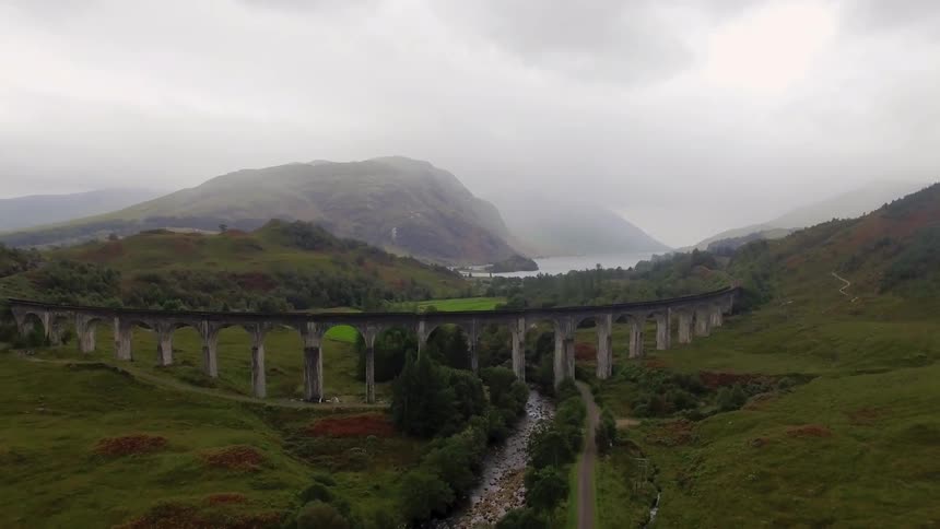 A bridge stands above a narrow river