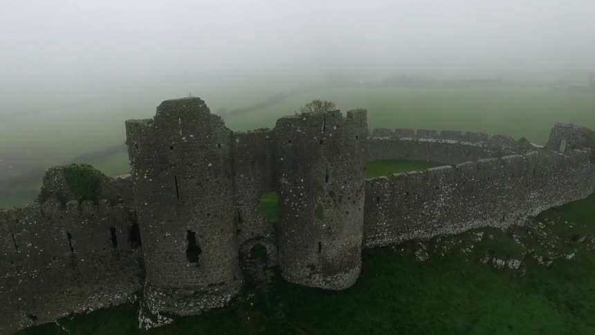 An aerial view of  some pieces of a building barely standing