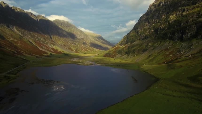 A small body of water sits between these mountains