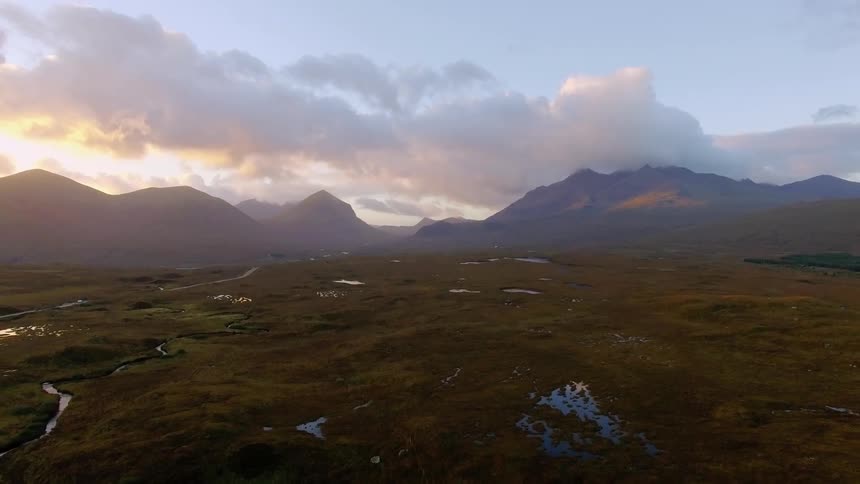The sun is setting over this large range