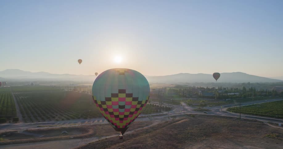Hot air balloons fill the sky