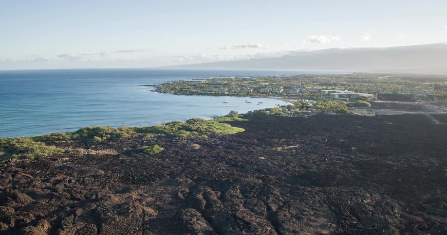 The green island is surrounded by blue water