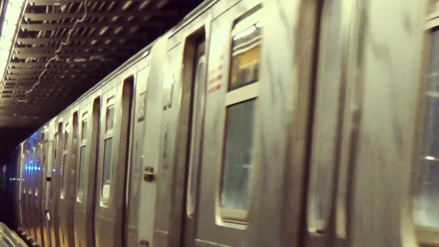 Subway train stopped at an underground platform