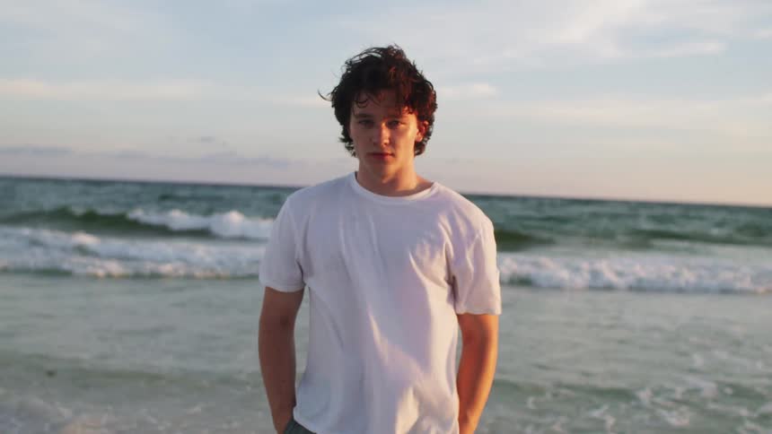A man stands on the beach