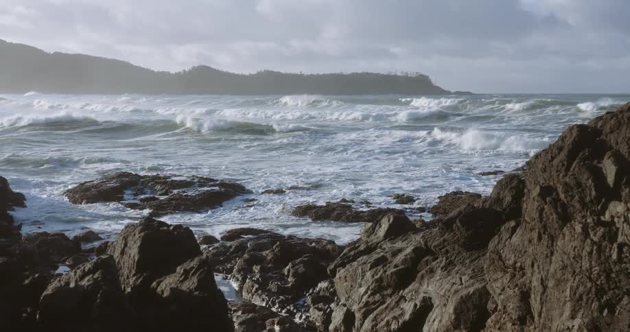 Waves crash against the rocks