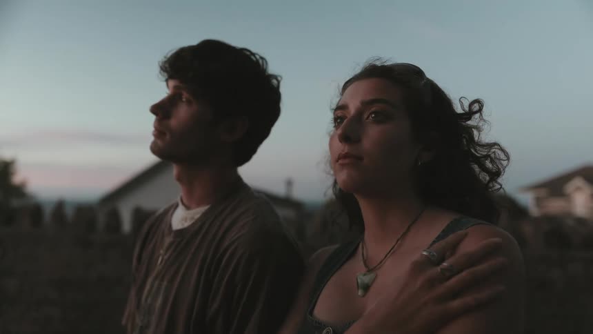 Man and woman as neutral expression in an outdoor setting