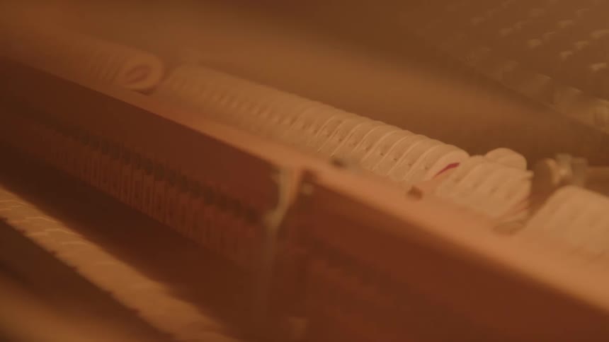 Closeup of the internal keys of a moving piano