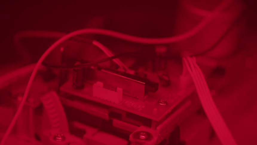 Electronic circuit board illuminated by red light