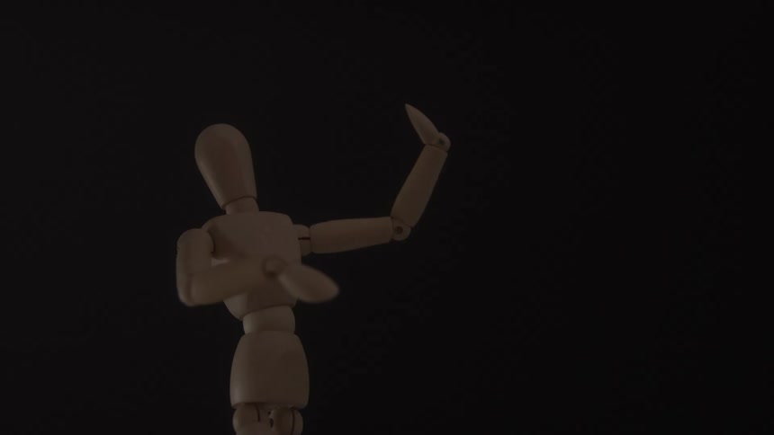 The wooden figurine is slowly moving