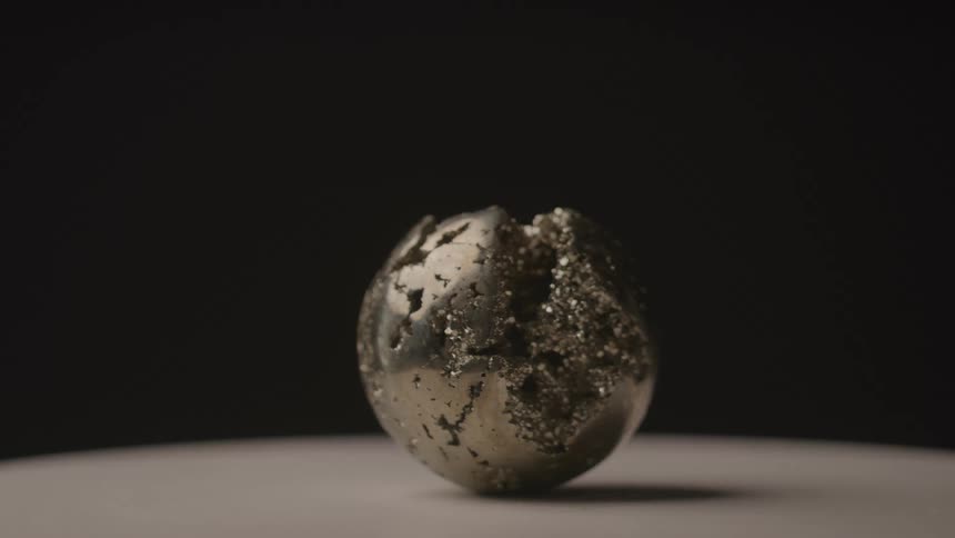A broken gritty sphere rotating