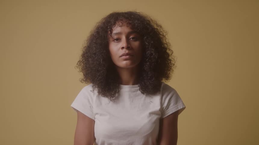A woman looks at the camera