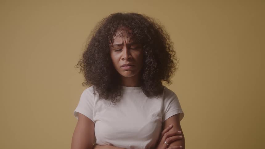 The woman is angry and shaking her head