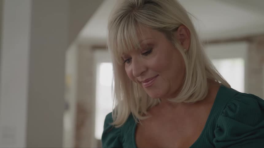A woman happily smiles