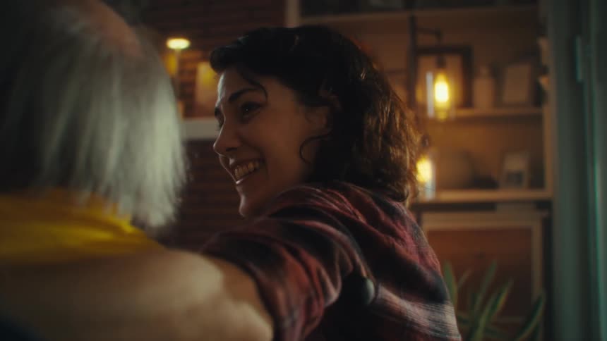 A man and woman get excited and hug