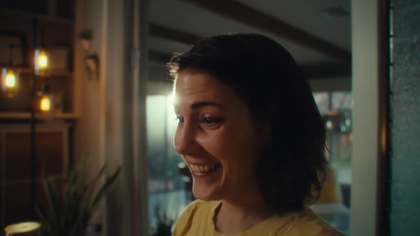 Woman with a surprised expression while holding a cellphone