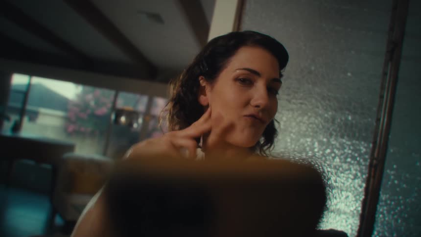 Woman being silly while facetiming on cell phone