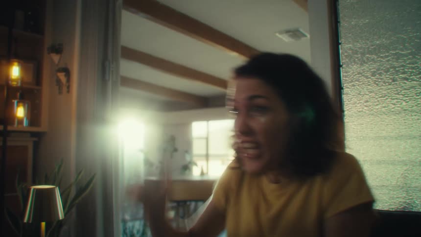 A woman is having fun playing video games