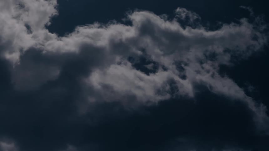 Clouds flow through the night sky